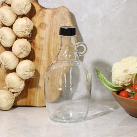 قنينة زيت زجاج نمرة 3 شكل برميل بيد غطا بلاستك لف EL130/6 =ط57